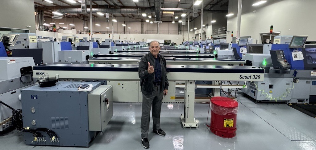 dr niznick standing in front of scout 320 machines
