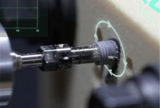 nobelbiocare implant being drilled in wood